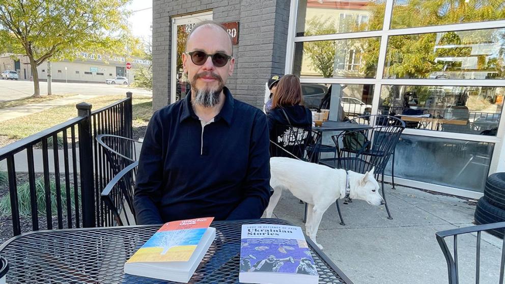 Vitaly Chernetsky with the two books his translations are in